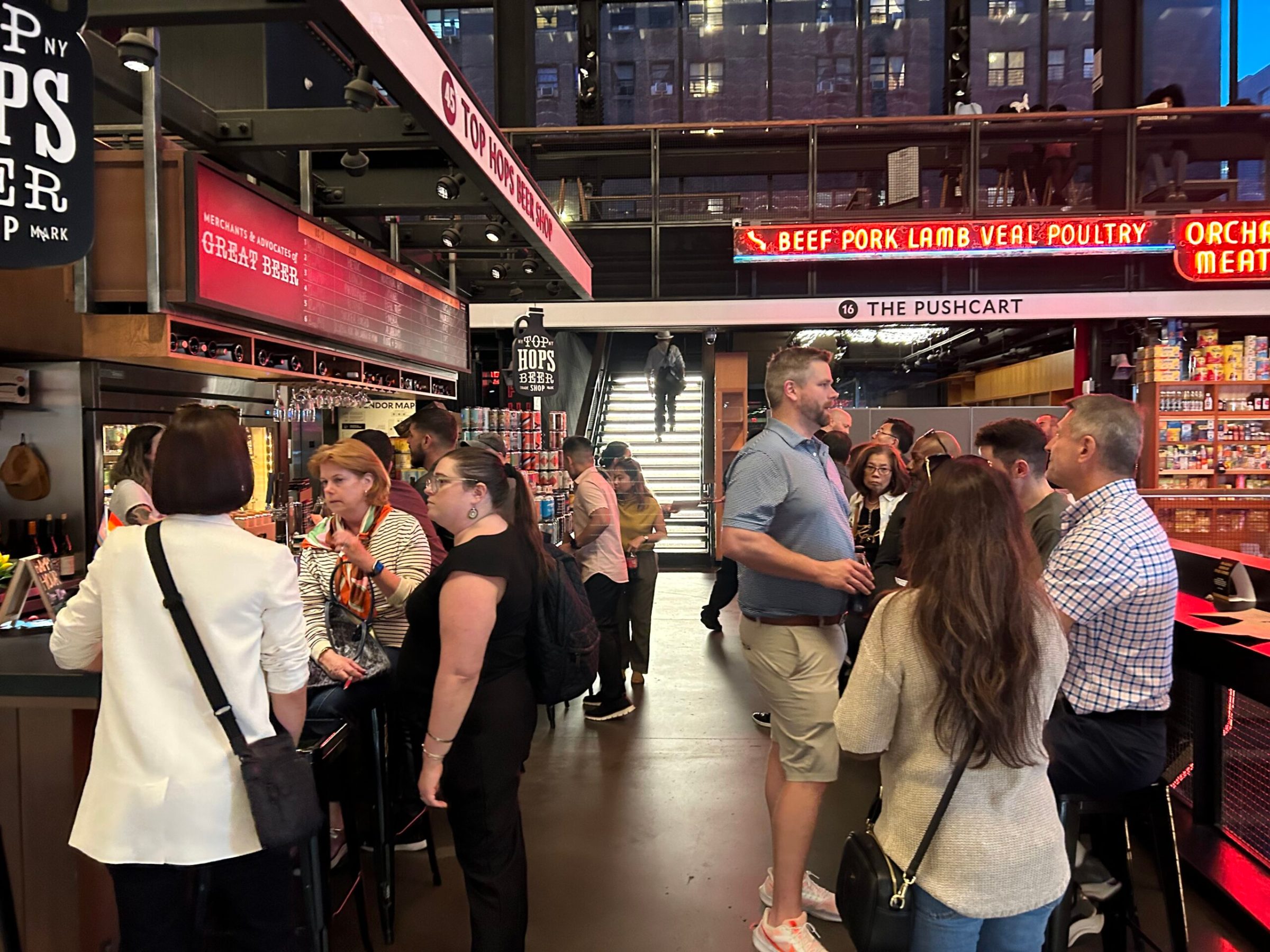 a group of people standing in front of a store