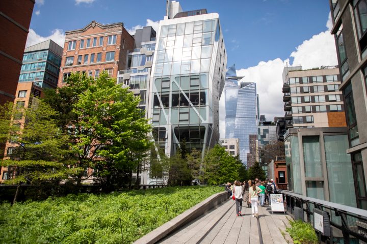 a group of people walking in front of a building