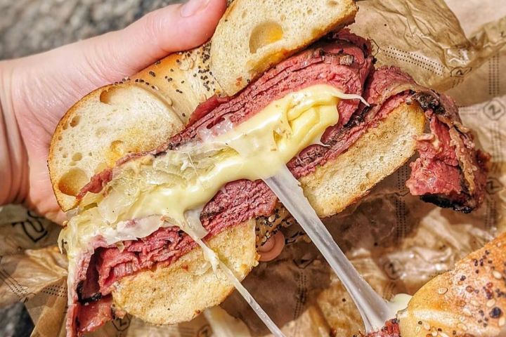 a close up of a bagel sandwich