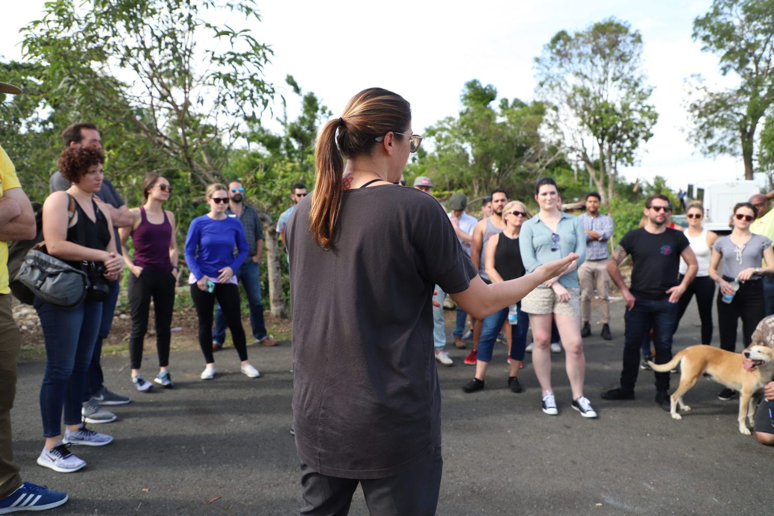 a woman addressing a group of volunteers