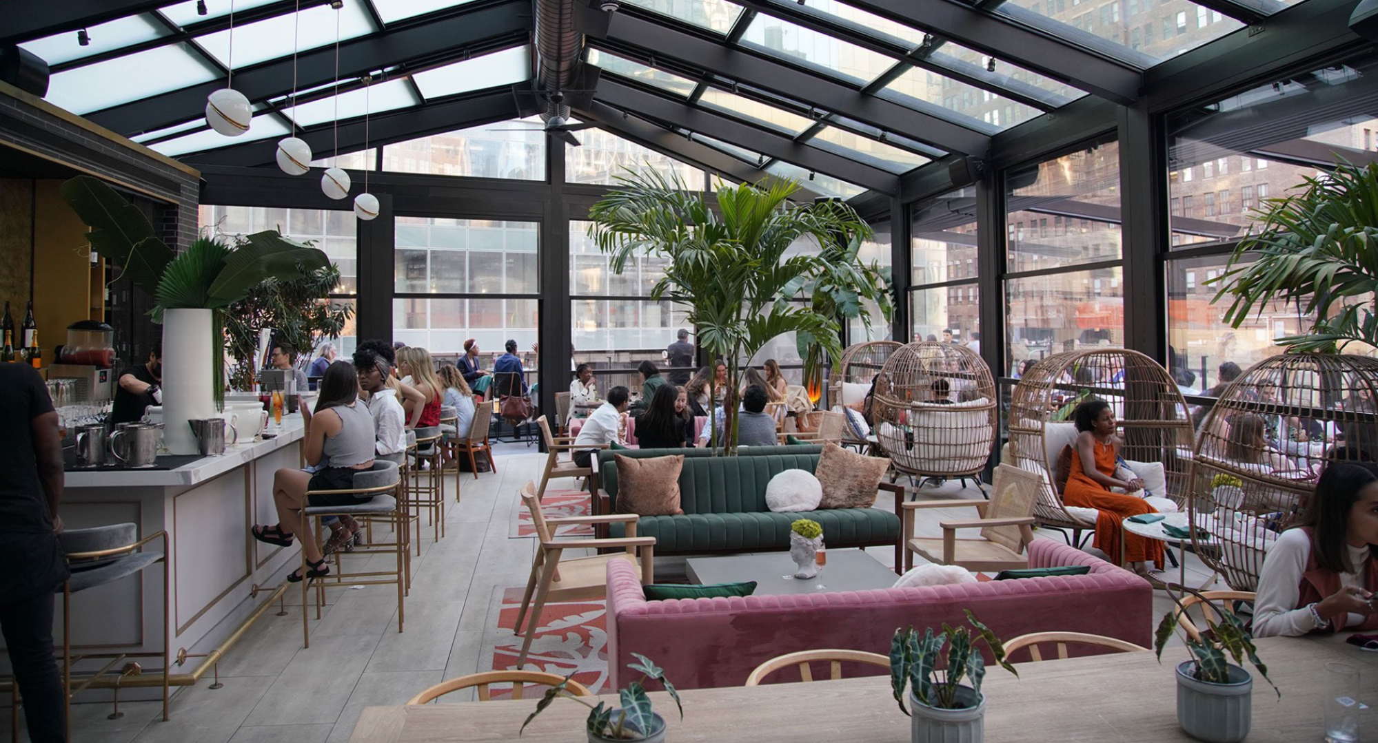 nyc rooftop glass ceiling restaurant with bar and a glass ceiling