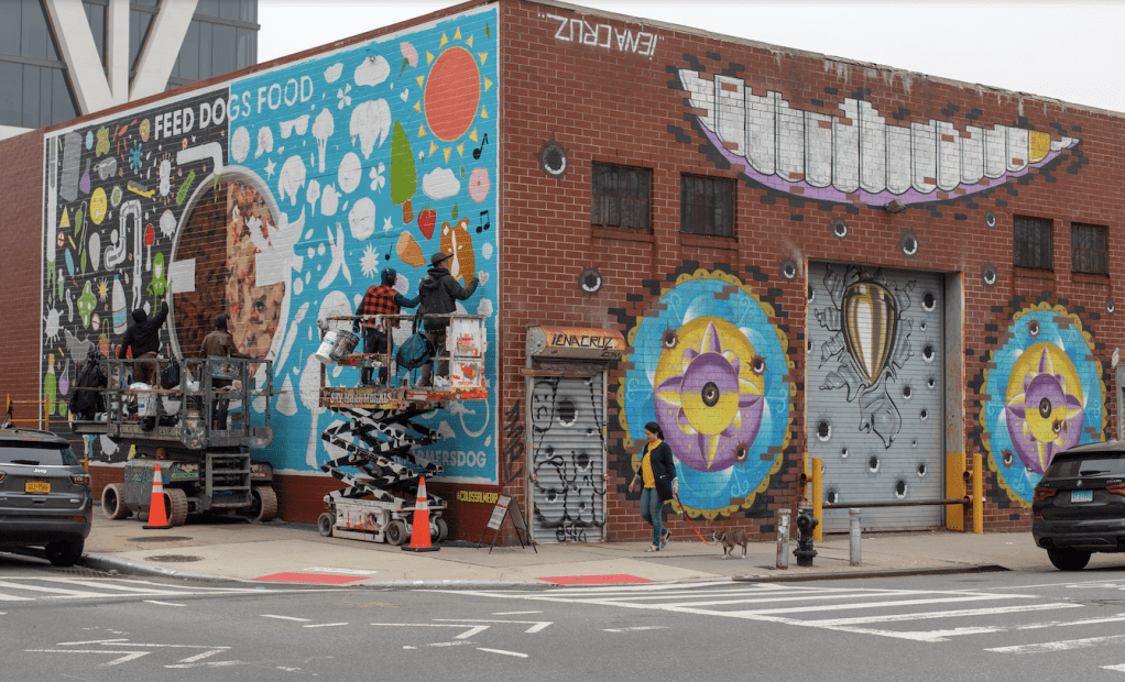 a street scene with focus on the side of a building