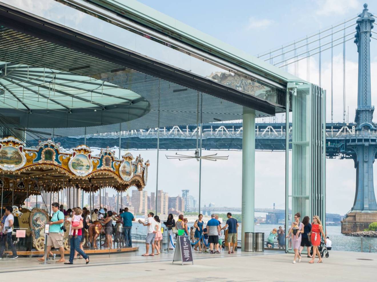a group of people riding a carousel