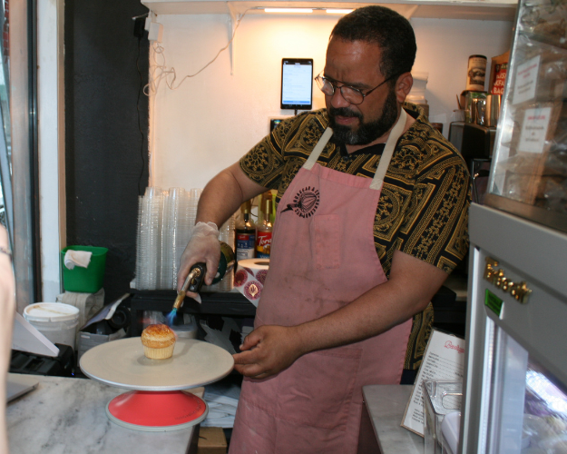 a man standing in a kitchen preparing food