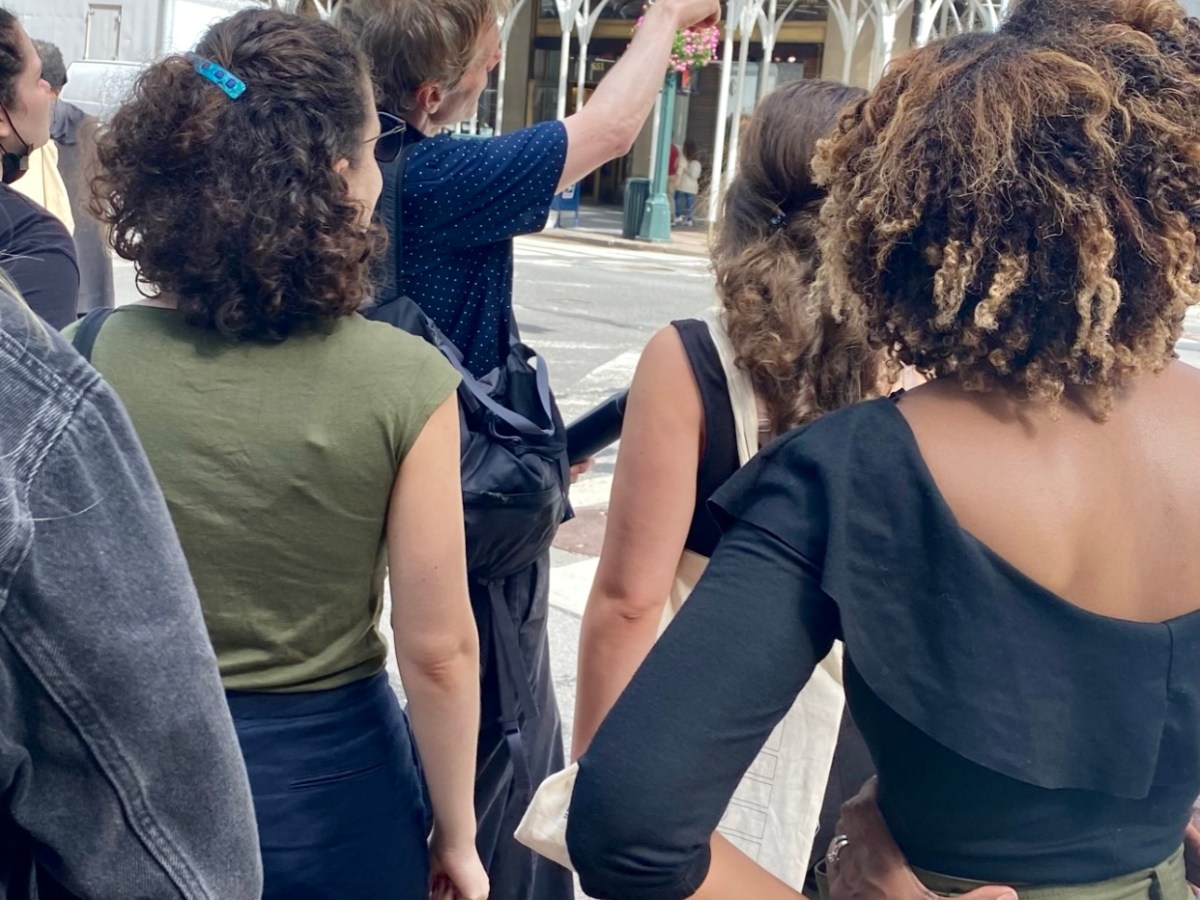 a group of people standing in front of a building