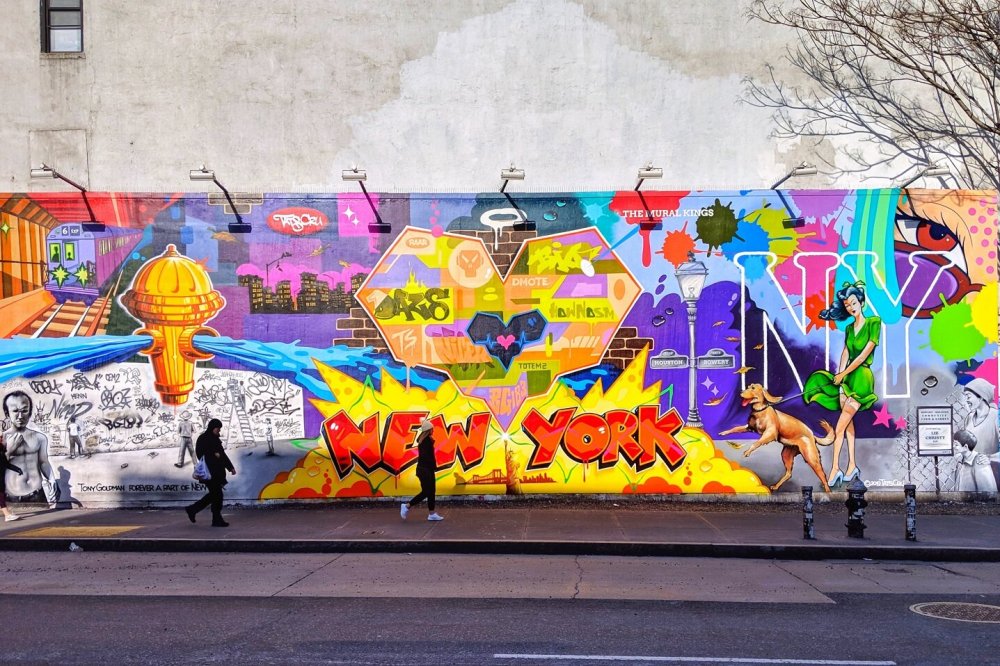 colorful graffiti on the side of a road