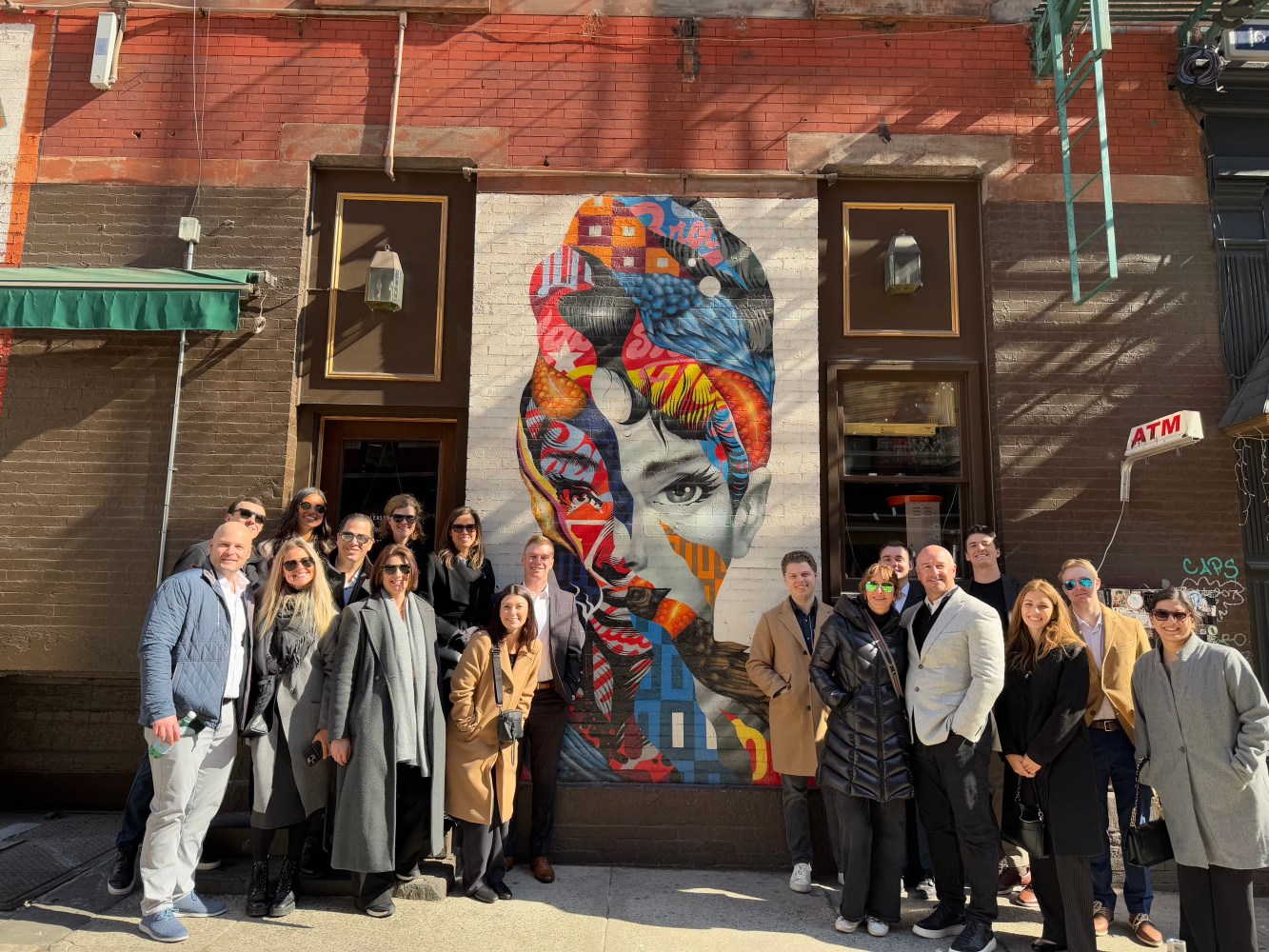 Corporate group outside of street art in new york city