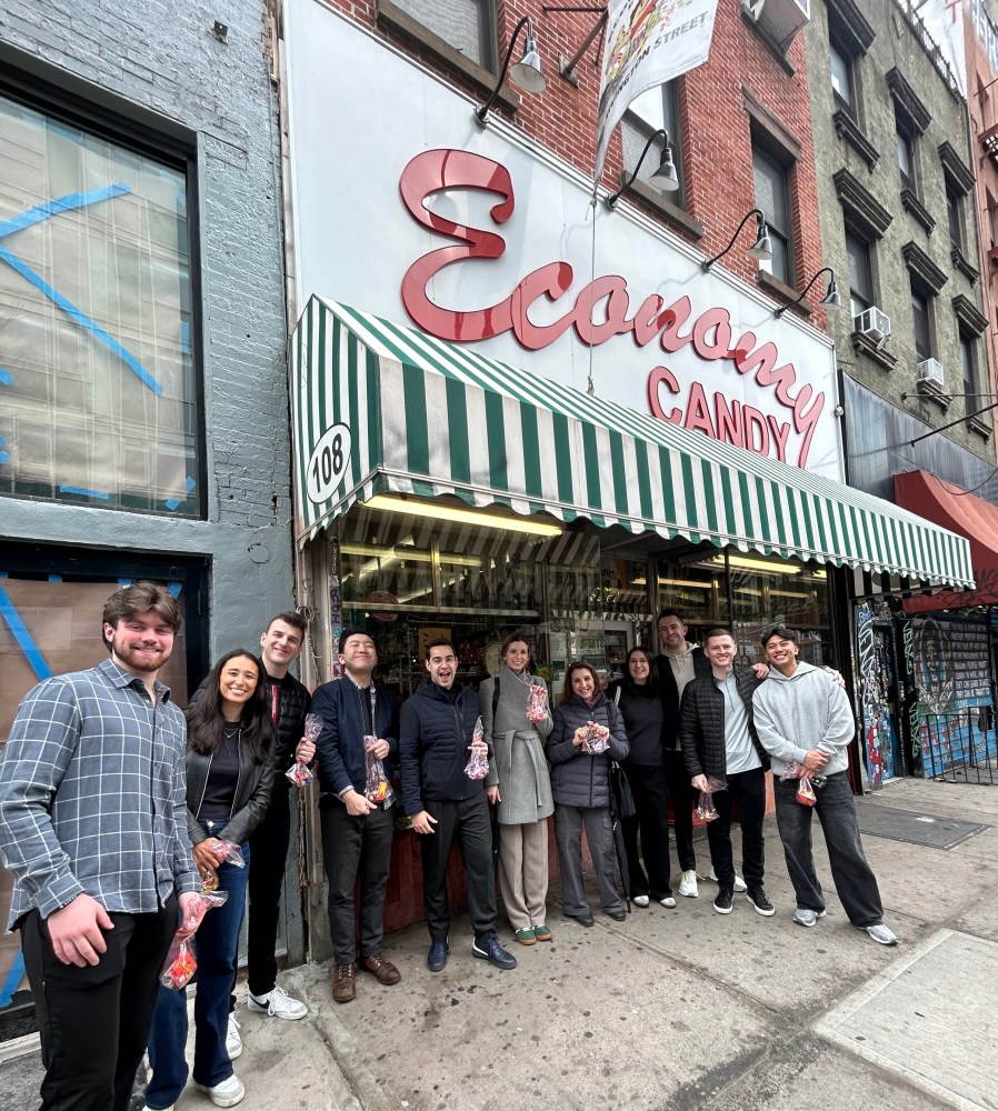 a group of people standing in front of Economy Candy